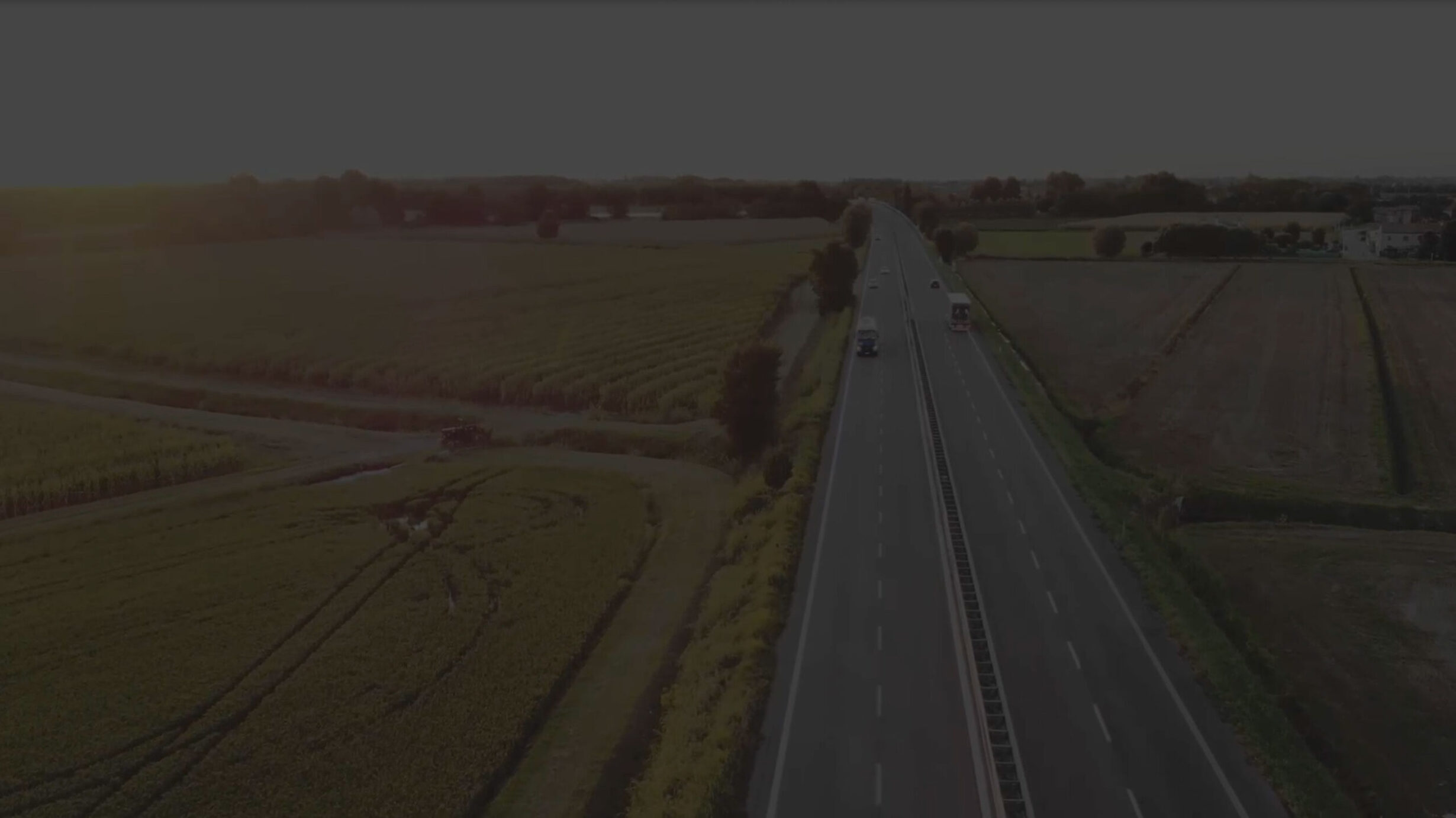 Background video poster image showing a road with vehicles